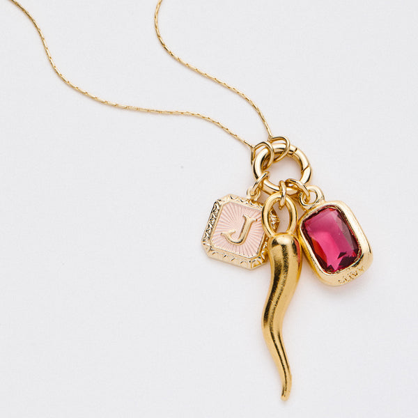 &LIVY Expandable Intention Chain Charm Necklace in finely finished gold featuring three charms gold Italian horn pink enamel letter charm and red crystal gemstone pendant on delicate gold chain