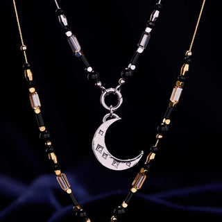 Midnight Rider Necklace featuring black onyx beads, glass beads, and crescent moon charm
