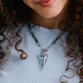 Expandable chain necklace styled as a choker on model