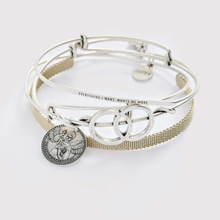 Gold and silver bracelet stack with sacred geometry design