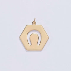 &LIVY Luck in Motion Charm in gold hexagonal pendant with horseshoe cutout design