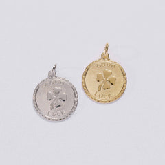&LIVY Good Luck Token Charm in both silver and gold round coin pendants featuring four-leaf clover and Good Luck engraving with scalloped edge
