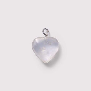 Heart-shaped pendant with a silver chain on a light gray background