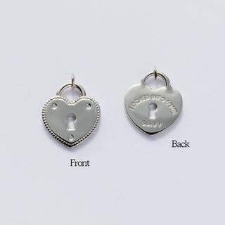 Heart-shaped silver lock pendants on a light gray background