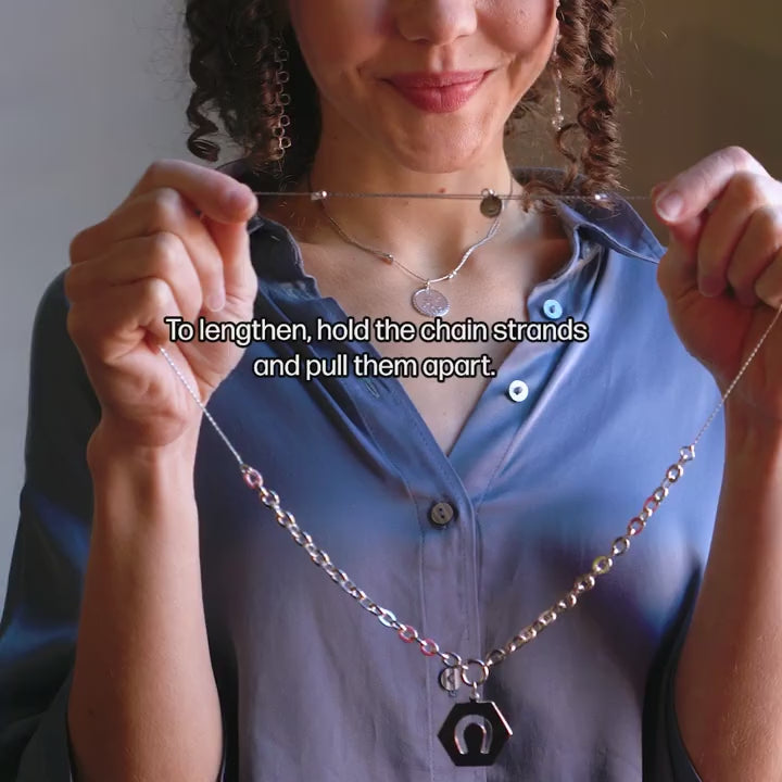 Video showcasing &LIVY Luck in Motion Expandable Necklace with hexagonal horseshoe charm on model
